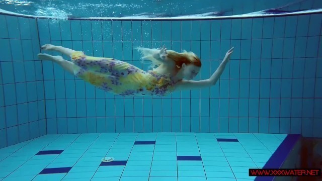 Blonde in a Dress in a Pool